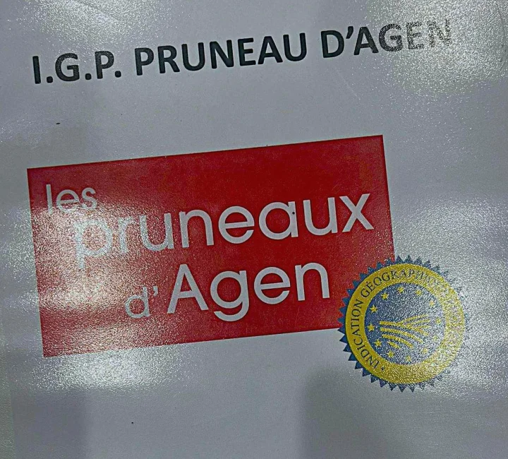 Agen prunes PGI identification sign displayed at the farm.